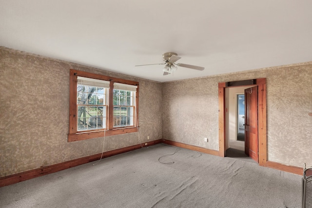 unfurnished room with carpet flooring and ceiling fan