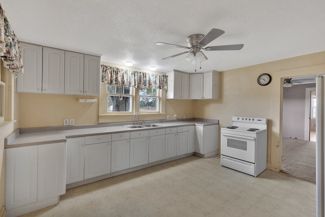 kitchen featuring a textured ceiling, sink, ceiling fan, and electric stove