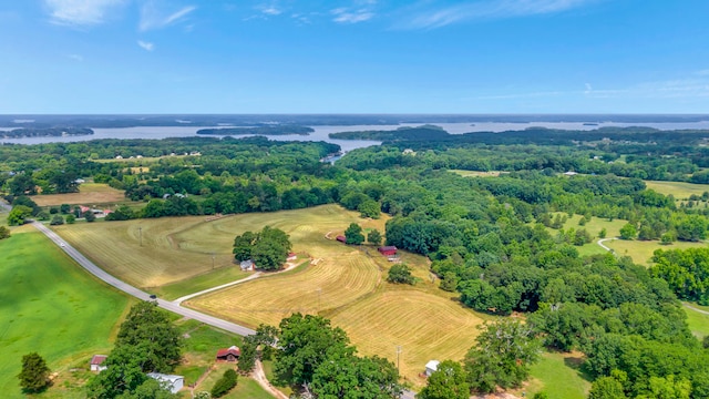 drone / aerial view featuring a water view and a rural view