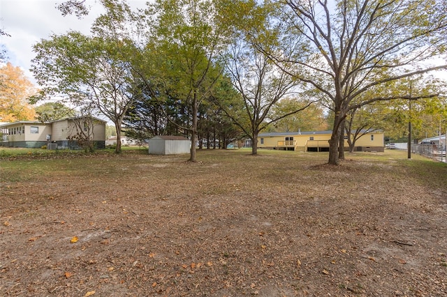 view of yard with a storage shed