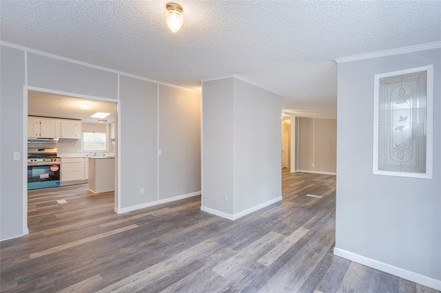 unfurnished living room featuring a textured ceiling, dark hardwood / wood-style floors, and ornamental molding