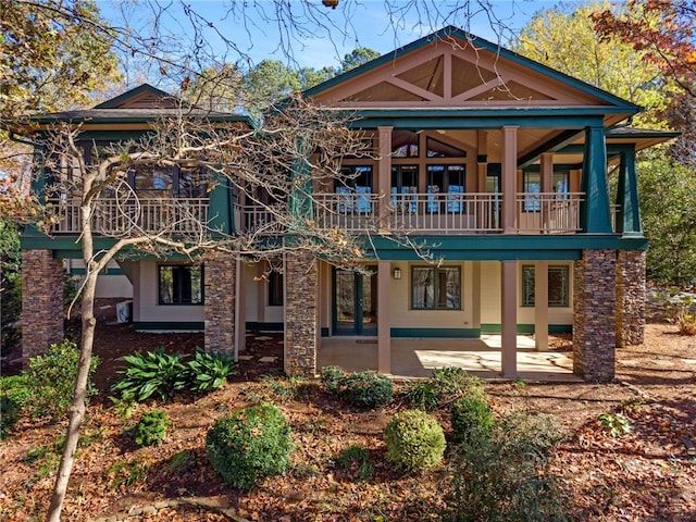 back of house with a balcony