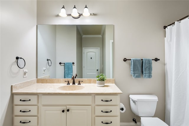 bathroom with vanity, toilet, and ornamental molding