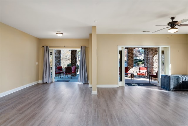 empty room featuring ceiling fan and wood-type flooring