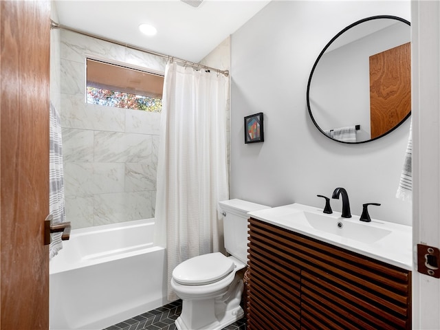 full bathroom featuring tile patterned floors, vanity, shower / bathtub combination with curtain, and toilet