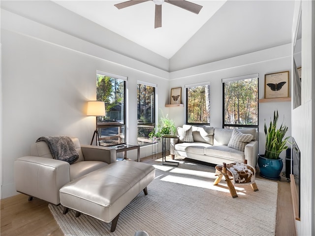 sunroom / solarium with plenty of natural light, ceiling fan, and lofted ceiling