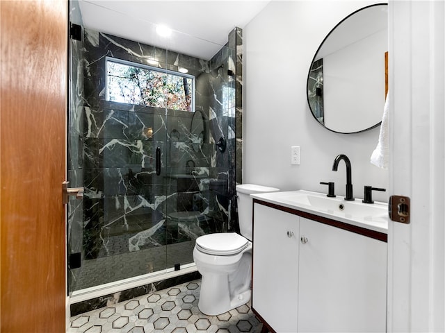 bathroom with tile patterned flooring, vanity, toilet, and a shower with door