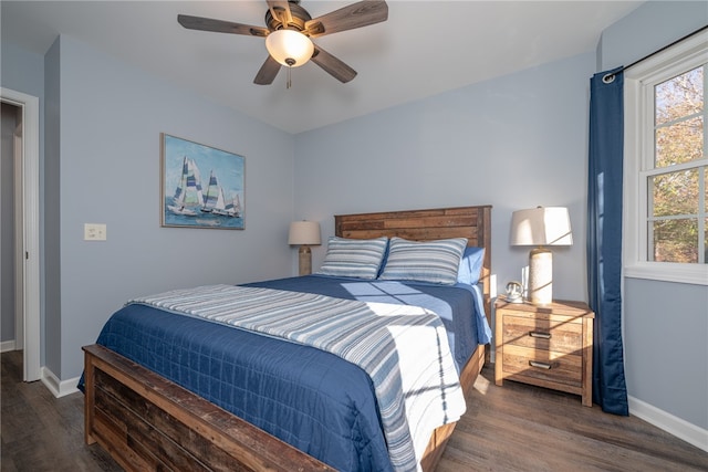 bedroom featuring ceiling fan and dark hardwood / wood-style flooring