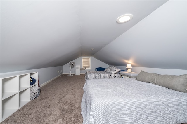 bedroom featuring light carpet and vaulted ceiling