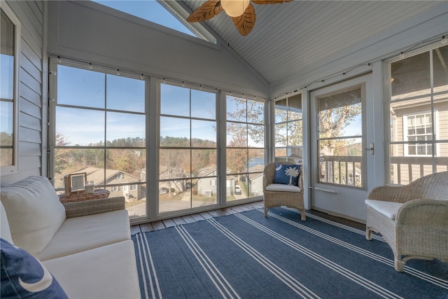 sunroom featuring vaulted ceiling, ceiling fan, and wooden ceiling