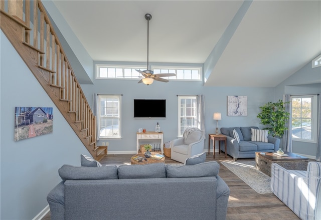 living room featuring ceiling fan, dark hardwood / wood-style flooring, and high vaulted ceiling