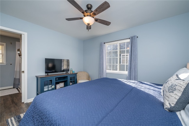 bedroom featuring ceiling fan and dark wood-type flooring