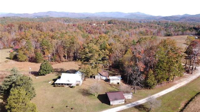 birds eye view of property with a mountain view and a rural view