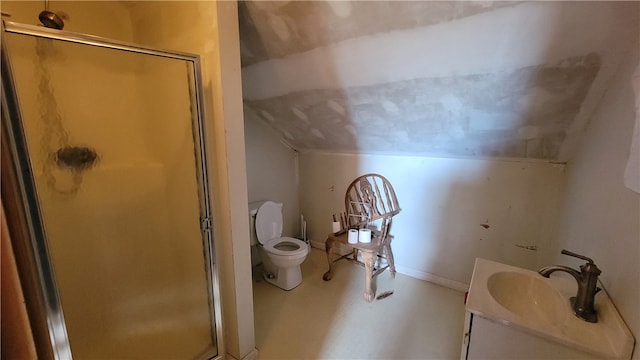 bathroom with lofted ceiling, vanity, toilet, and a shower with shower door