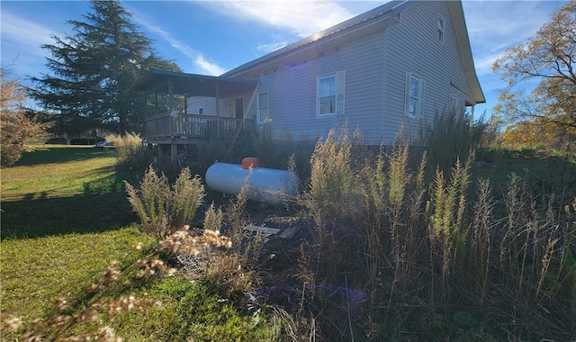 view of home's exterior with a lawn