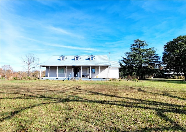 view of front facade with covered porch and a front yard