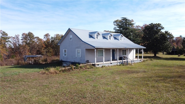 cape cod-style house featuring a porch and a front lawn