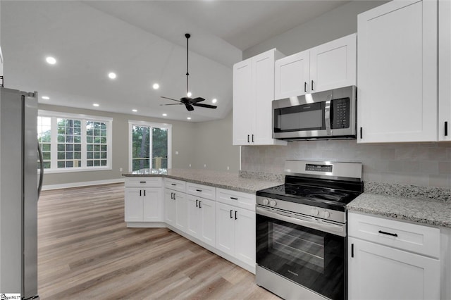 kitchen with ceiling fan, stainless steel appliances, light stone counters, light hardwood / wood-style flooring, and white cabinets