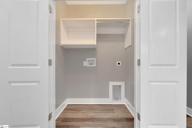 laundry room with hookup for a washing machine, light hardwood / wood-style flooring, and hookup for an electric dryer