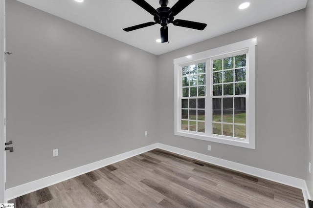 empty room with light wood-type flooring and ceiling fan