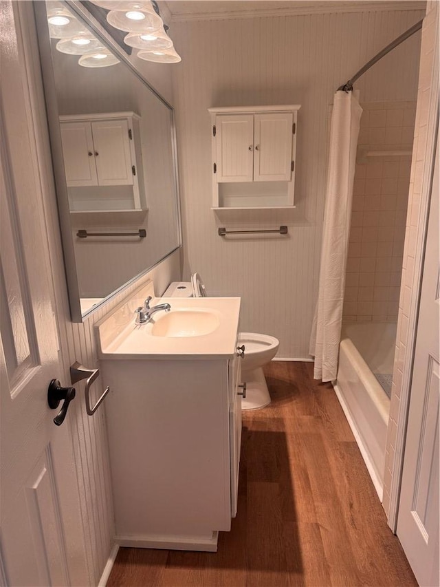 full bathroom featuring shower / bath combination with curtain, vanity, toilet, and hardwood / wood-style floors