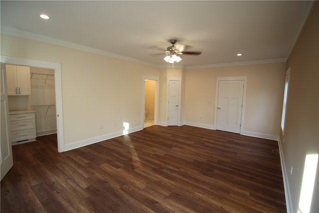 unfurnished room featuring ceiling fan, crown molding, and dark hardwood / wood-style floors