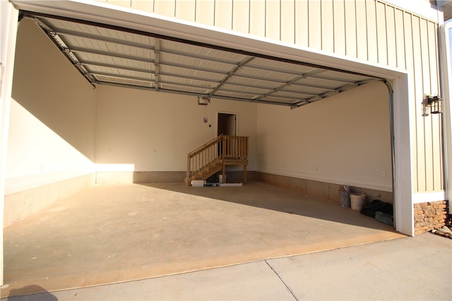 garage featuring a garage door opener and a carport