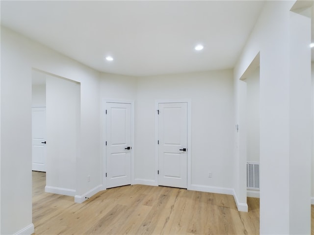 unfurnished room with light hardwood / wood-style floors