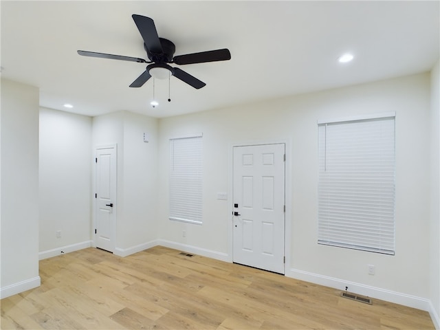 unfurnished room with light hardwood / wood-style floors and ceiling fan