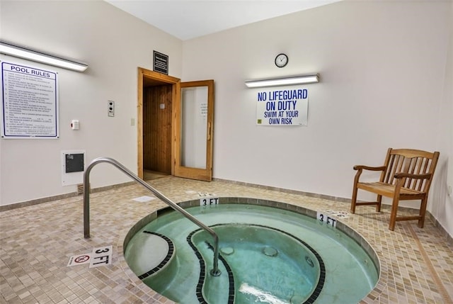 view of pool with an indoor in ground hot tub