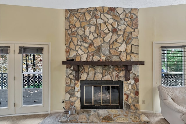 room details with a fireplace and a textured ceiling