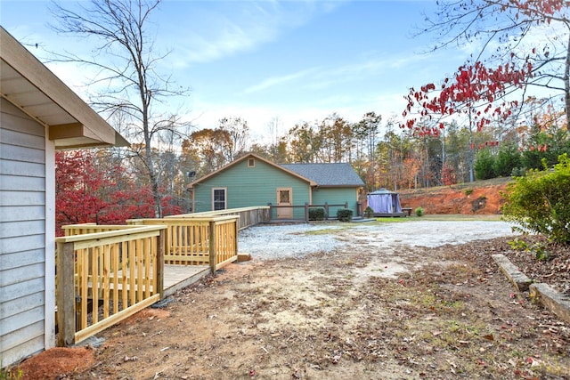 view of yard with a wooden deck