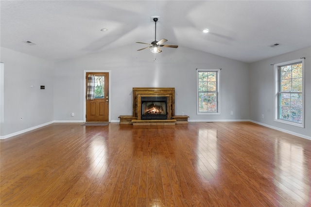 unfurnished living room featuring hardwood / wood-style flooring, ceiling fan, and lofted ceiling