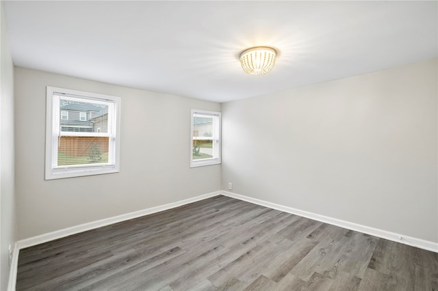 spare room with hardwood / wood-style floors