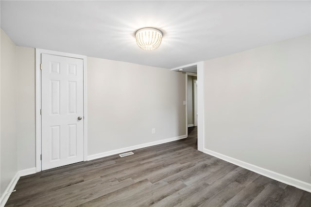 empty room featuring dark hardwood / wood-style floors