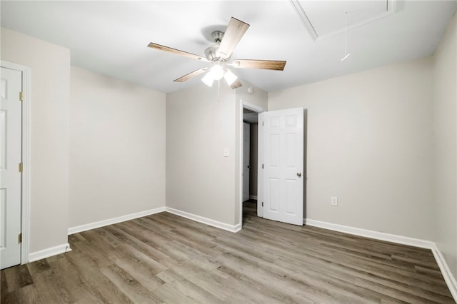 unfurnished bedroom featuring hardwood / wood-style flooring and ceiling fan