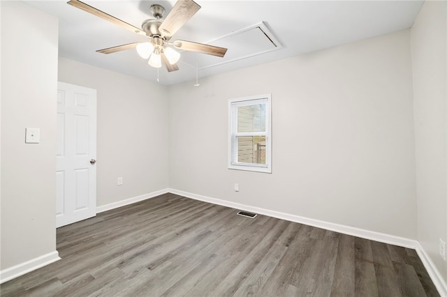 spare room with hardwood / wood-style flooring and ceiling fan