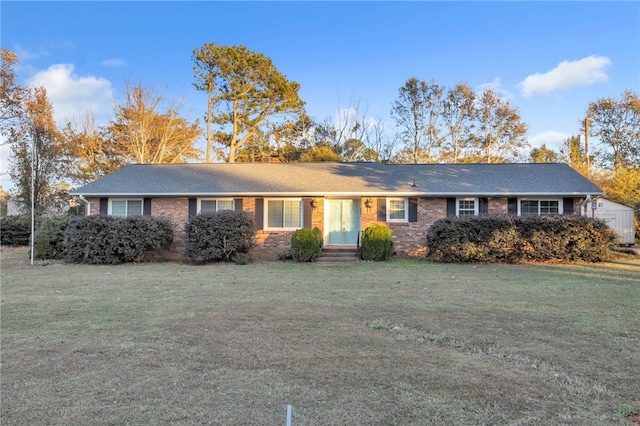 ranch-style home featuring a front yard