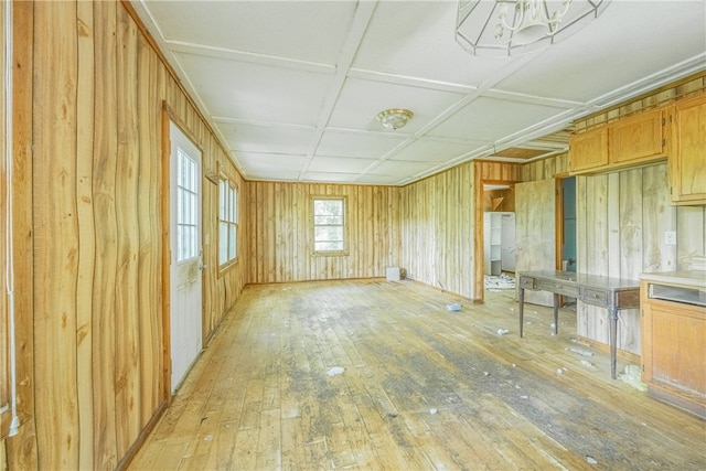 interior space featuring wooden walls and light hardwood / wood-style flooring