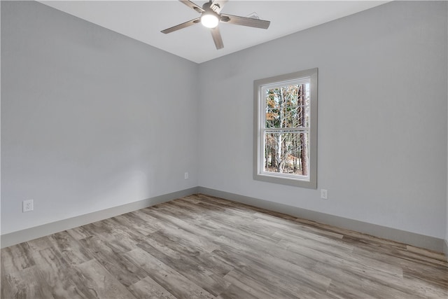 spare room featuring ceiling fan and light wood-type flooring