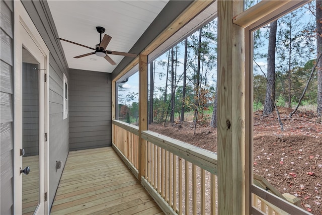 sunroom / solarium with ceiling fan and a healthy amount of sunlight