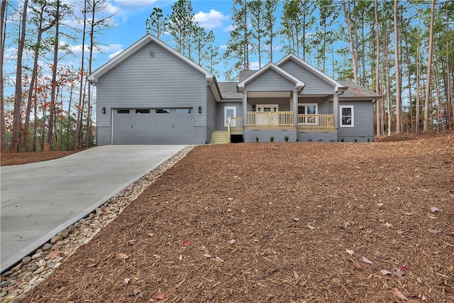 view of front facade featuring a porch and a garage