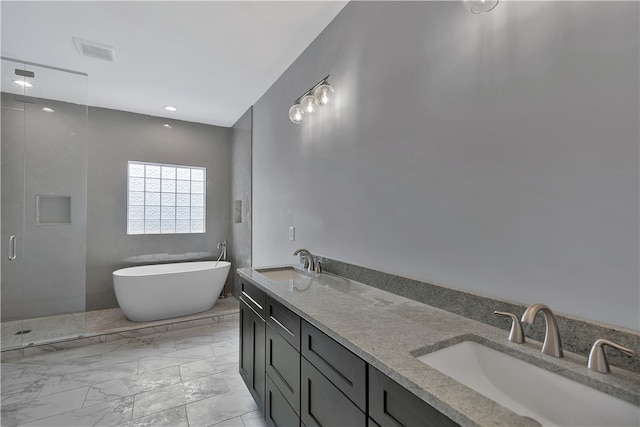 bathroom with vanity and separate shower and tub