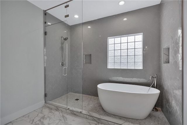 bathroom with separate shower and tub