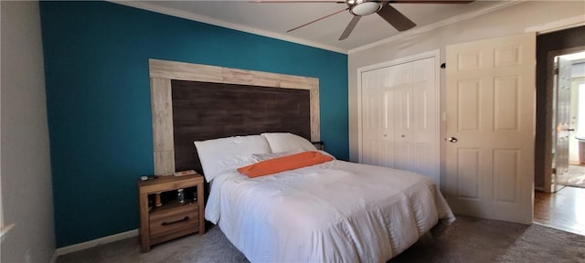 bedroom with ornamental molding, ceiling fan, dark colored carpet, multiple windows, and a closet