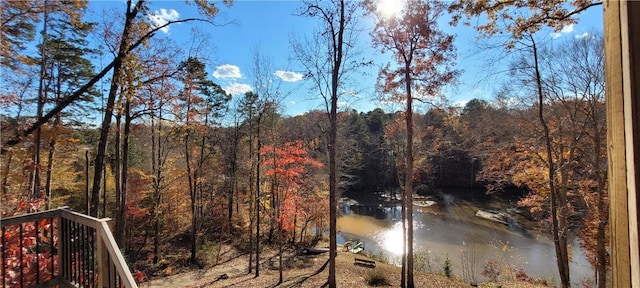 view of local wilderness with a view of trees and a water view