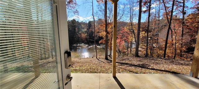 exterior space featuring a patio area and a water view