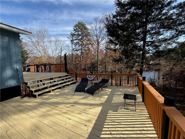 wooden deck with a water view