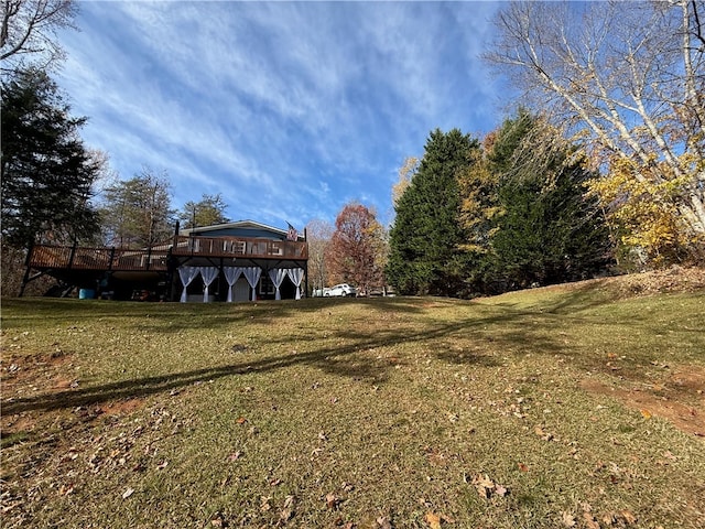 view of yard with a wooden deck