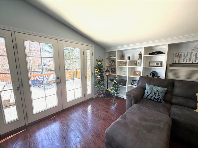 entryway with french doors, dark wood-type flooring, and vaulted ceiling